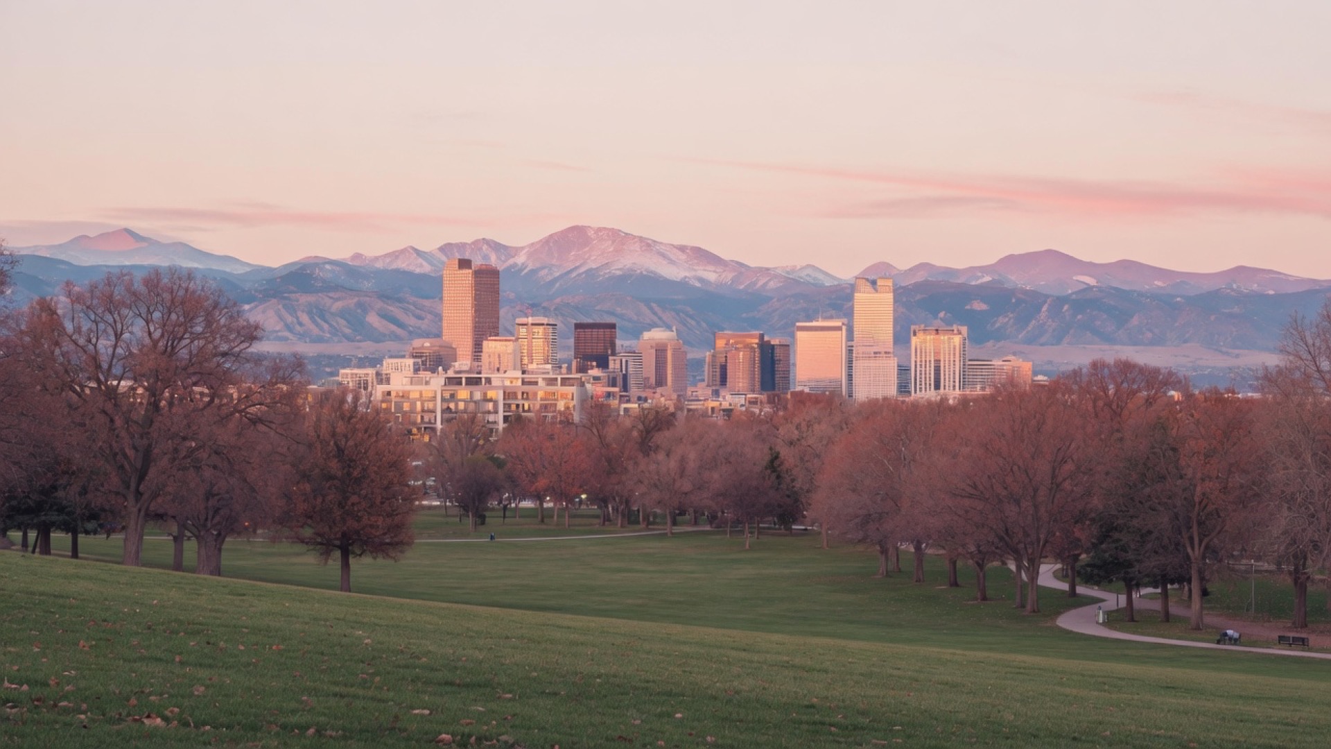 City park and mountains at dusk over Denver