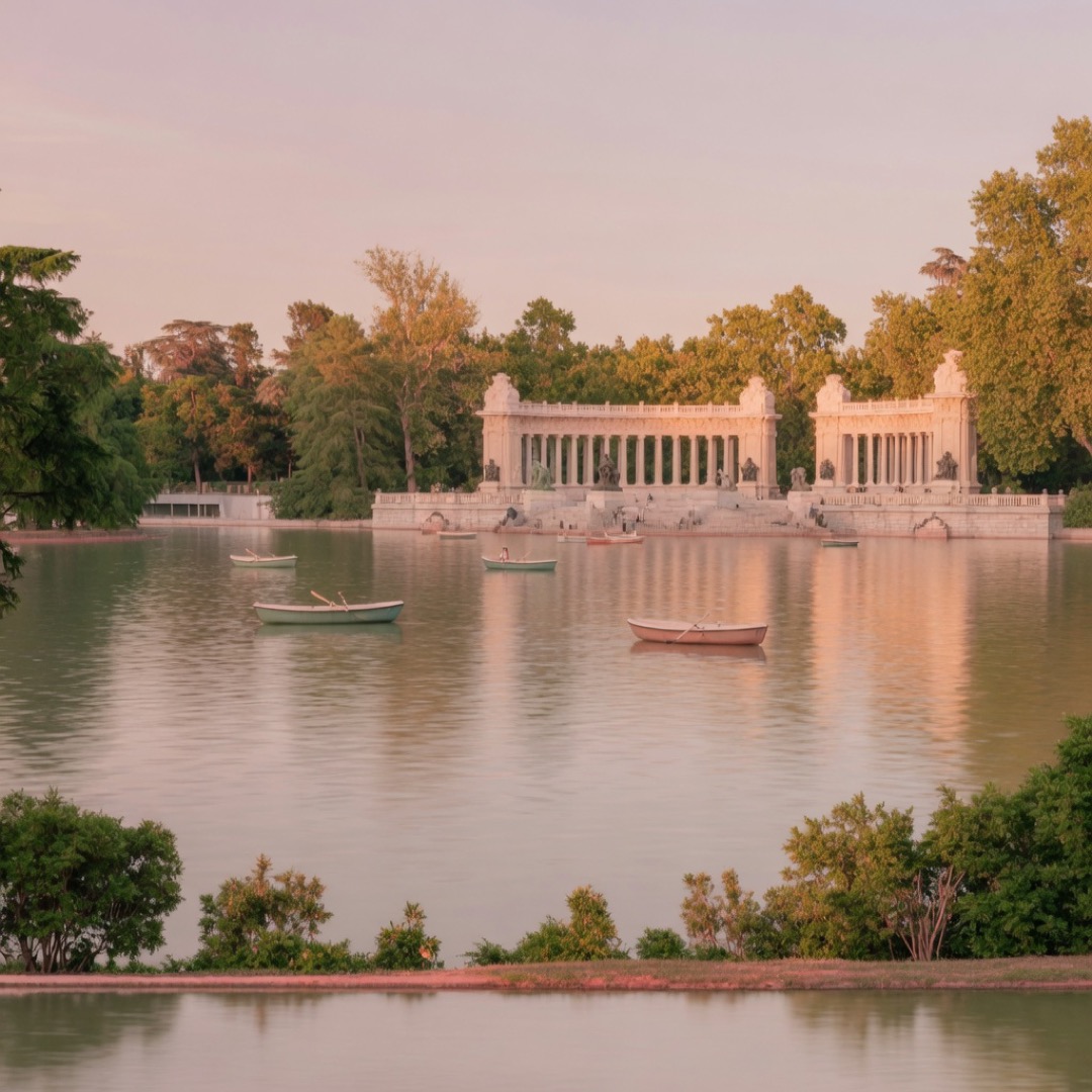 Lake and Alfonso XII monument in El Retiro Park, Madrid at golden hour
