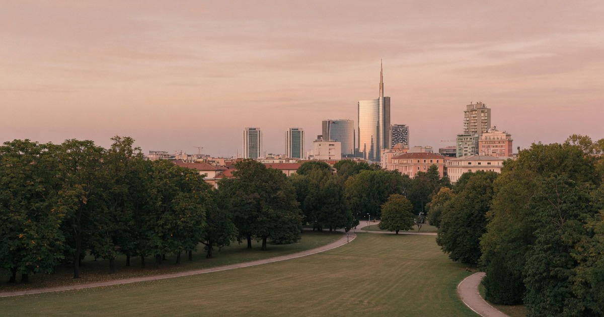 Soft dusk light over Milan's Sempione park and skyline for a first-meet guide