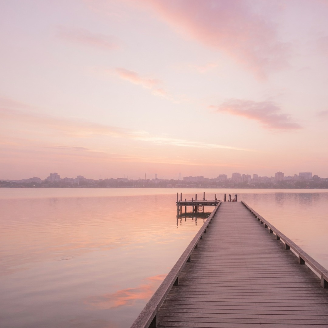 Lake Niguarda jetty in Parco Nord with the Milan skyline at sunset