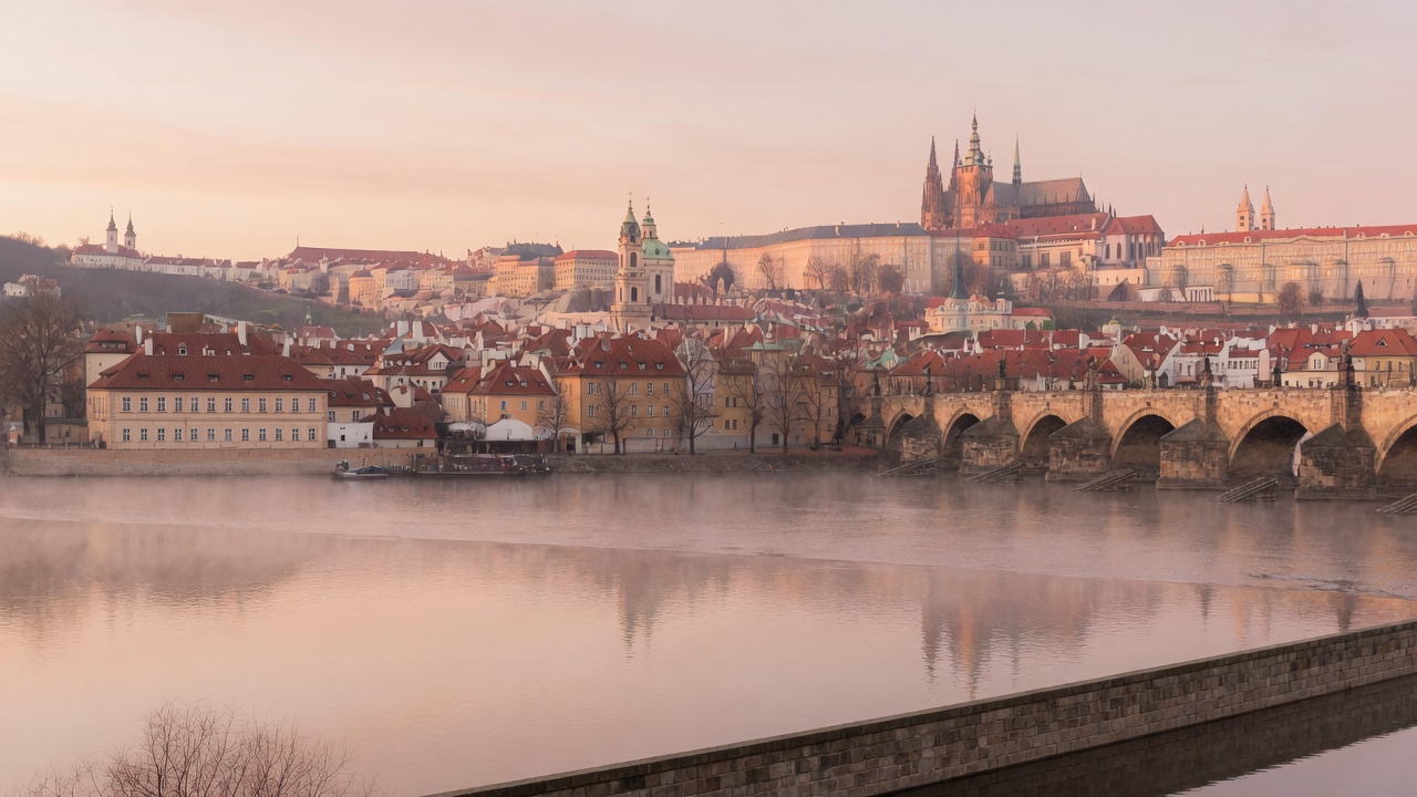 Prague golden hour over the Vltava with the Castle on the hill