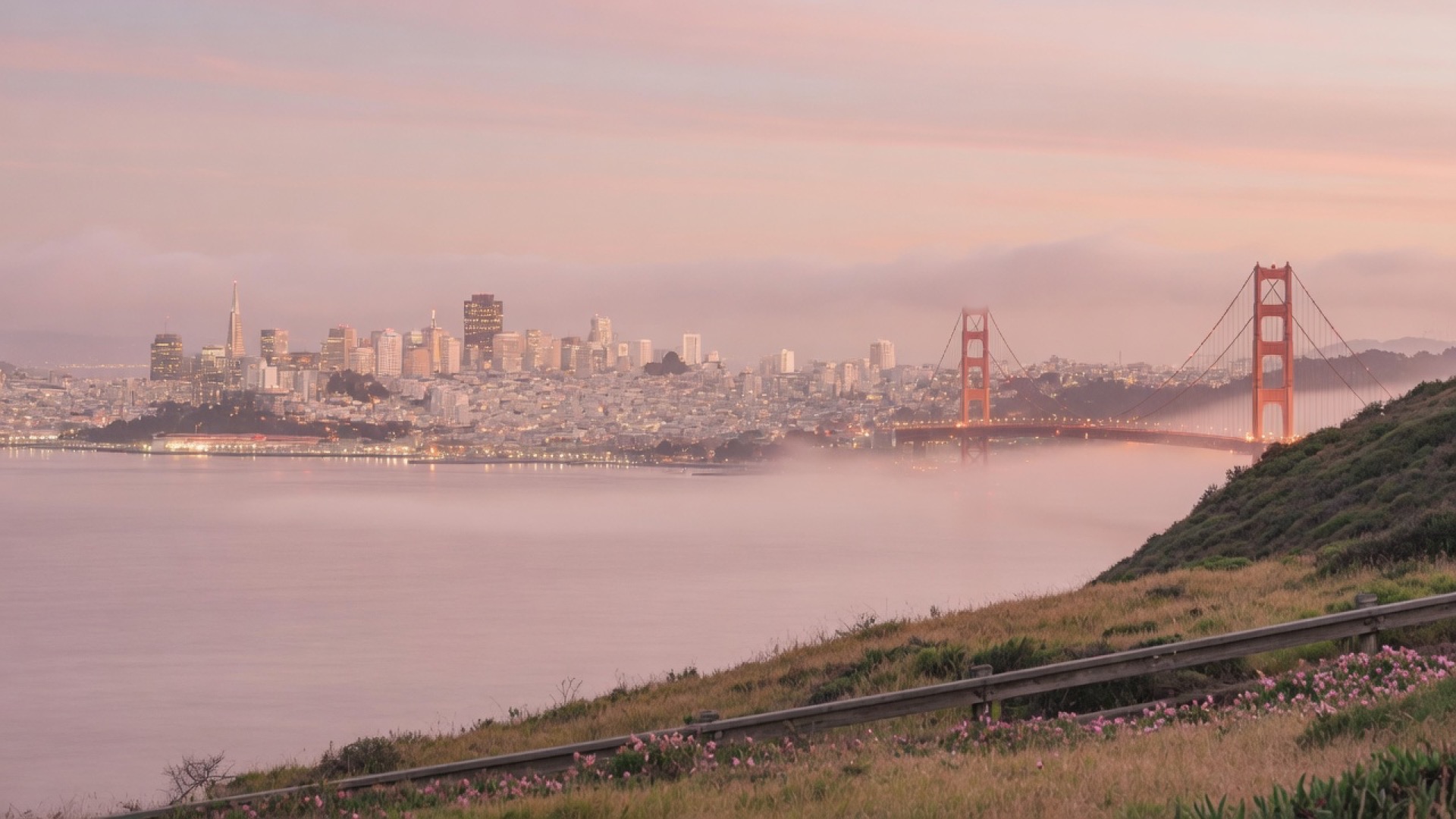 San Francisco bay and skyline at dusk, fog lifting
