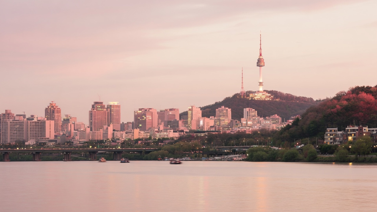 Seoul skyline and the Han River at dusk with Namsan Tower