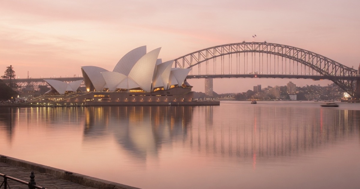 Sydney Harbour at dusk with the Opera House and Harbour Bridge