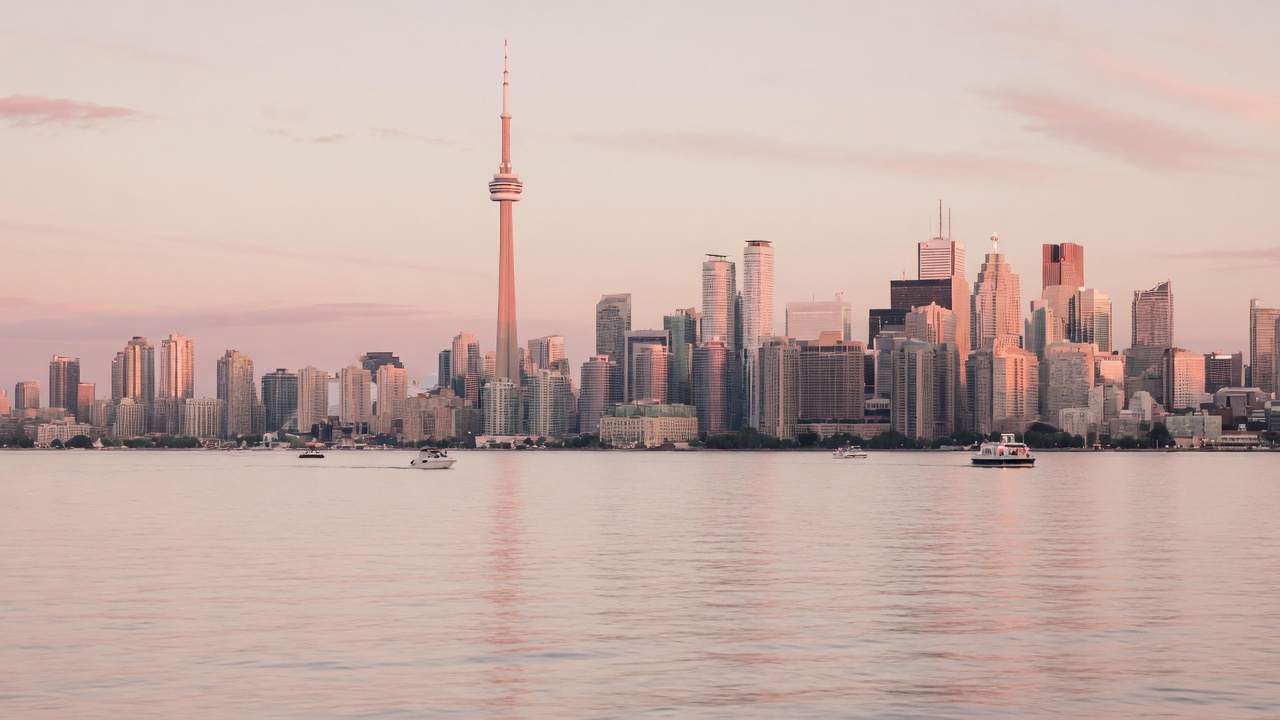 Toronto skyline over Lake Ontario at dusk from the islands
