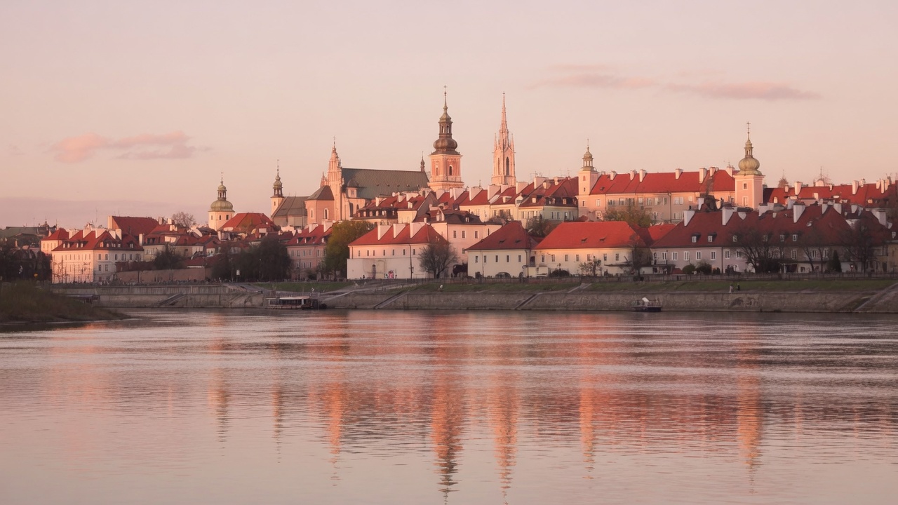 Warsaw golden hour over the Vistula with the Old Town skyline
