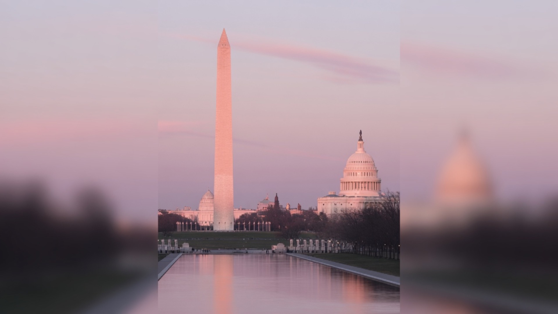 Monument green and the Washington skyline at dusk
